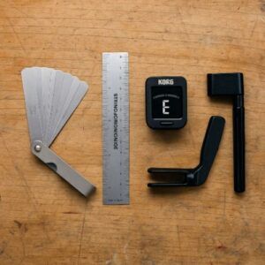 Feeler gauges, string action ruler, tuner, and winder