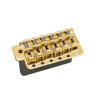Gotoh GE101TS vintage-style gold tremolo bridge with six saddles and steel springs, shown from an angled front view