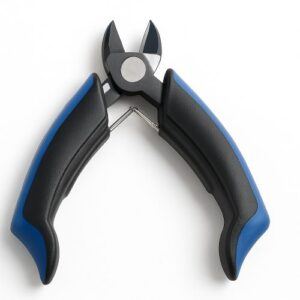 Close-up image of the MusicNomad GRIP string cutter with alloy-steel blades and ergonomic blue-and-black handles on a white background.