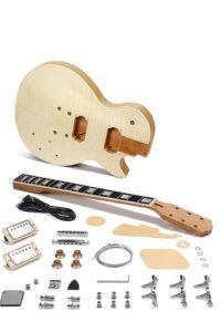 Unassembled Les Paul–style DIY electric guitar kit with flamed maple body, bolt-on neck, humbuckers, wiring, bridge, tuners, knobs, and hardware laid out on a white background.