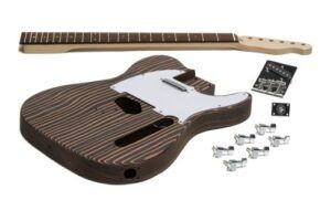 Unassembled Solo TCKZEB-1 DIY electric guitar kit showing the engineered zebrawood Tele-style body, maple neck, hardware, and electronics laid out on a white background.