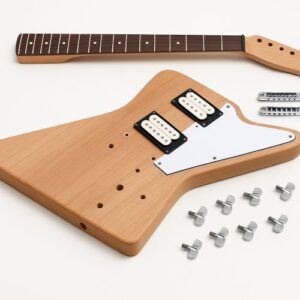 Unassembled Explorer-style DIY guitar kit shown on a white background, featuring an unfinished natural wood body with two humbuckers and pickguard installed, a separate bolt-on neck, bridge hardware, tailpiece, and chrome tuners laid out around the body.