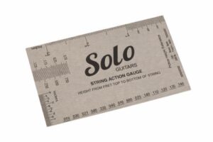 Solo Guitars string action gauge for measuring guitar string height on a white background