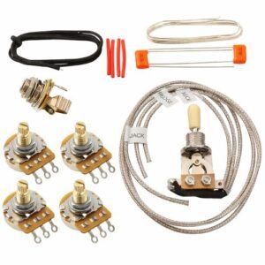 Les Paul–style guitar wiring kit with four control pots, toggle switch, braided shielded wiring, capacitors, and installation hardware