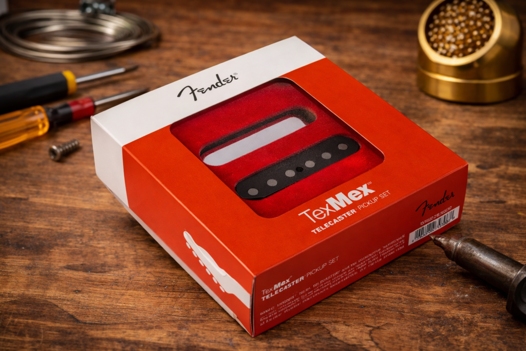 Fender Tex-Mex Telecaster pickup set box on rustic wooden workbench with guitar tools